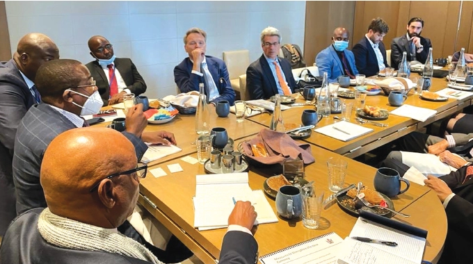 Finance and Economic Development Minister Mthuli Ncube (wearing surgical mask) addresses international investors keen to invest in the Government’s US dollar bond in Washington last week