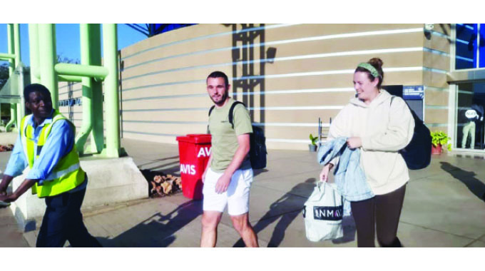 Aston Villa Captain John McGinn and Wife Arrive at Victoria Falls
