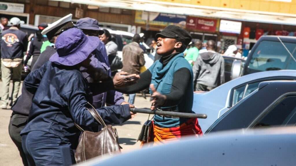Harare Municipal Police Dragging Female Vendor On A Tarred Road